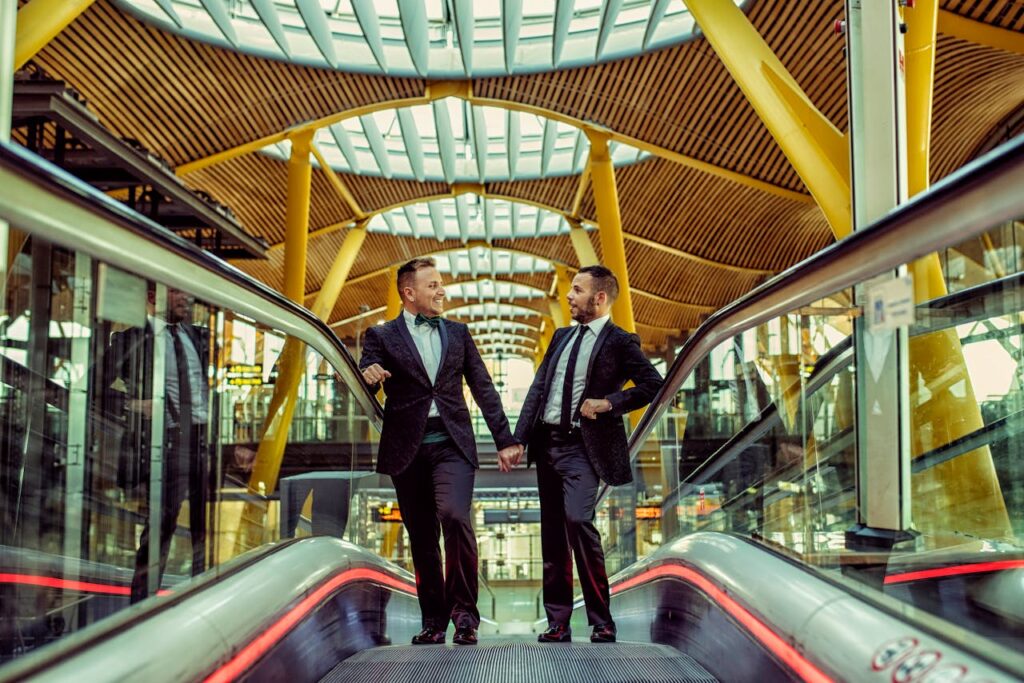 Man in Black Suit Standing on Escalator